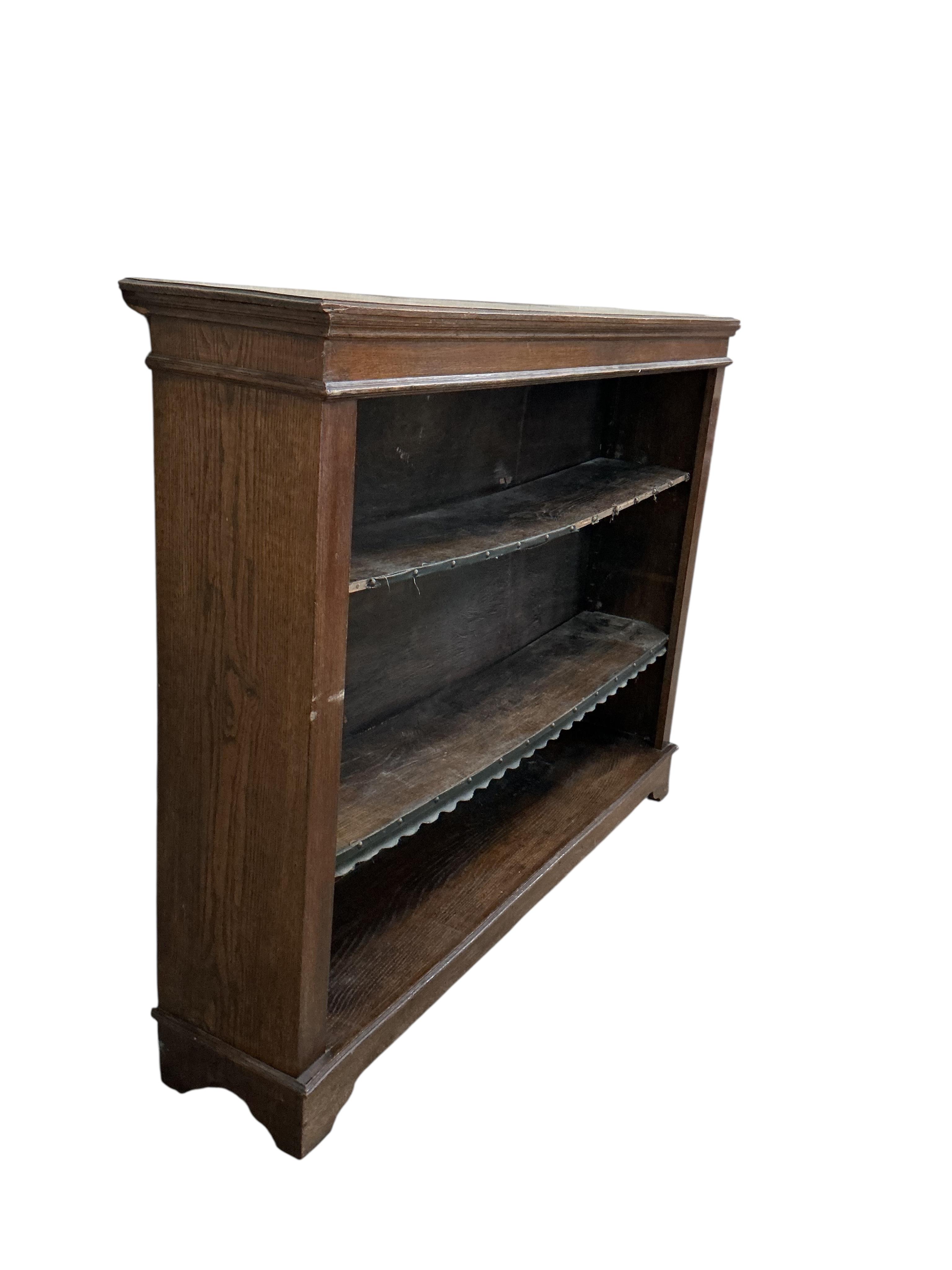 A Victorian oak open bookcase, width 138cm, depth 29cm, height 106cm